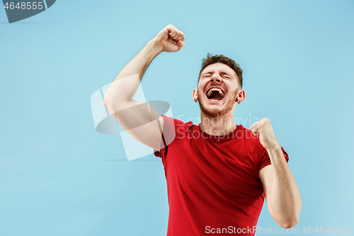 Image of Winning success man happy ecstatic celebrating being a winner. Dynamic energetic image of male model