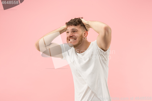 Image of Winning success man happy ecstatic celebrating being a winner. Dynamic energetic image of male model