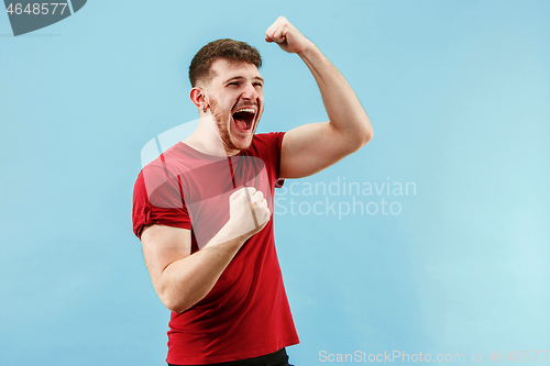 Image of Winning success man happy ecstatic celebrating being a winner. Dynamic energetic image of male model