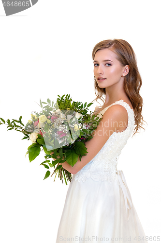 Image of beautiful girl in white dress with big bouquet