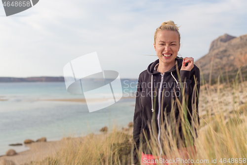 Image of Relaxed Happy Woman Enjoying Walk on Beach