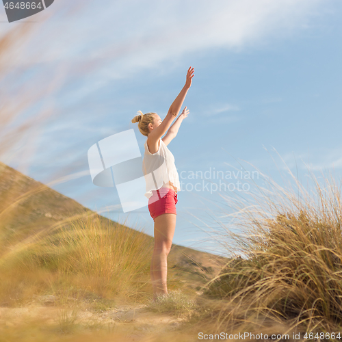 Image of Free Happy Woman Enjoying Sun on Vacations.