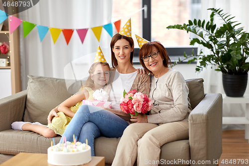 Image of mother, daughter and grandmother at birthday party