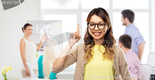 Image of asian woman in glasses or student with finger up