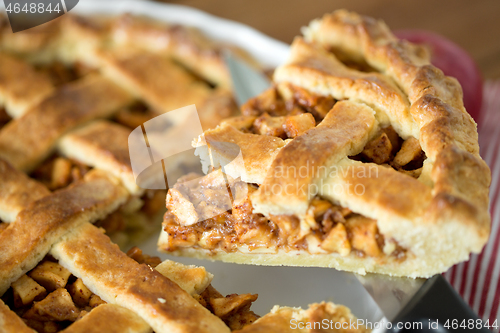 Image of close up of apple pie piece on kitchen knife