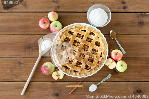 Image of close up of apple pie on wooden table