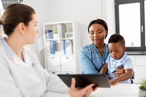 Image of mother with baby and doctor with tablet at clinic