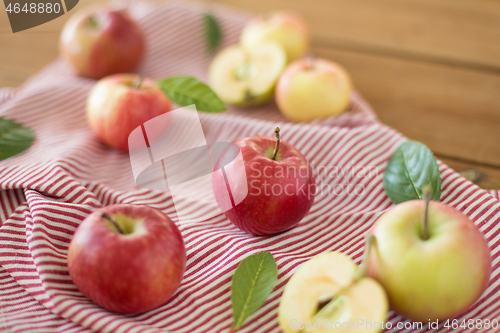 Image of ripe red apples on wooden table