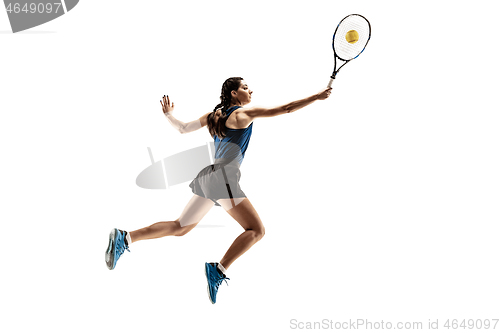 Image of Full length portrait of young woman playing tennis isolated on white background