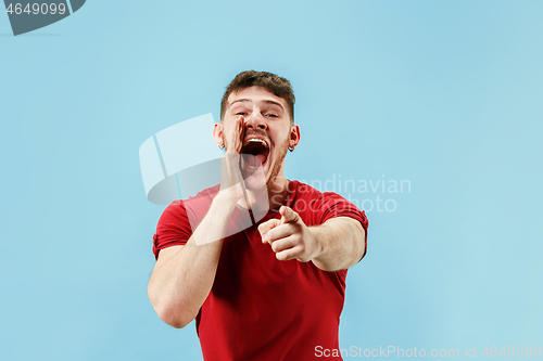 Image of Isolated on pink young casual man shouting at studio