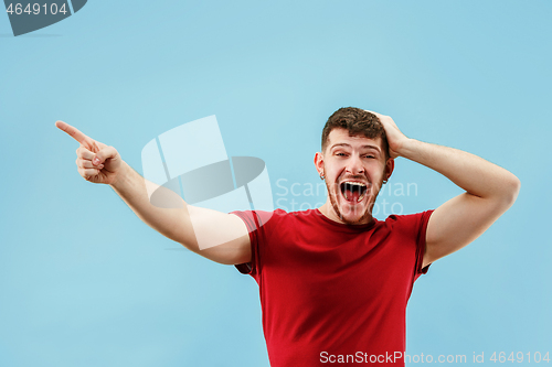 Image of Isolated on pink young casual man shouting at studio