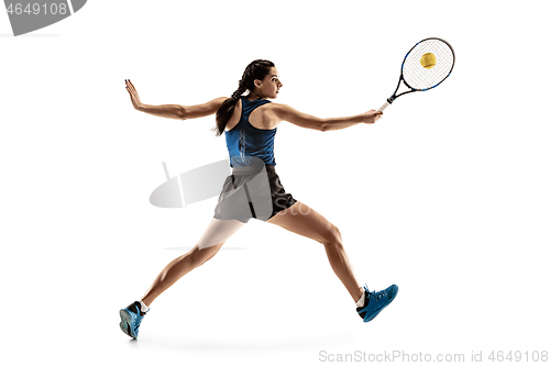 Image of Full length portrait of young woman playing tennis isolated on white background