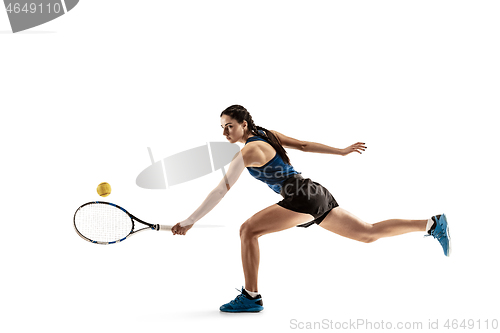 Image of Full length portrait of young woman playing tennis isolated on white background