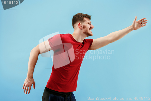 Image of Isolated on pink young casual man shouting at studio