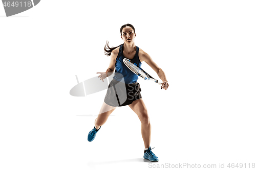 Image of Full length portrait of young woman playing tennis isolated on white background