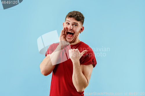 Image of Isolated on pink young casual man shouting at studio