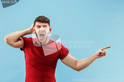 Image of Isolated on pink young casual man shouting at studio