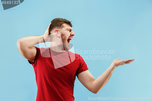 Image of Isolated on pink young casual man shouting at studio