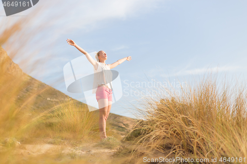 Image of Free Happy Woman Enjoying Sun on Vacations.