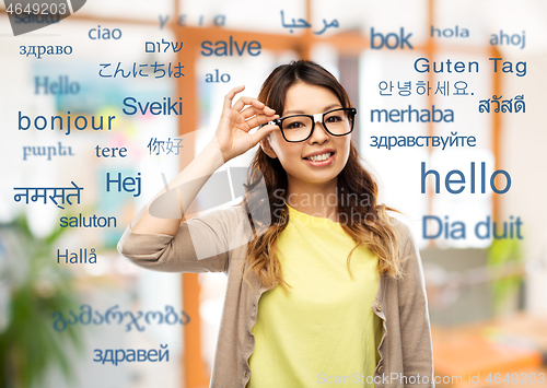 Image of happy asian woman in glasses or student