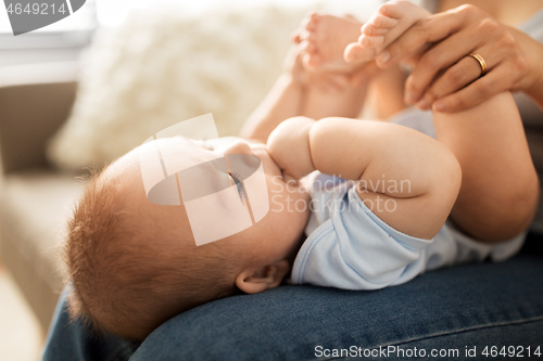 Image of close up of little asian baby boy and mother