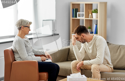 Image of senior woman psychologist and sad man patient