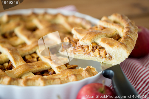 Image of close up of apple pie piece on kitchen knife