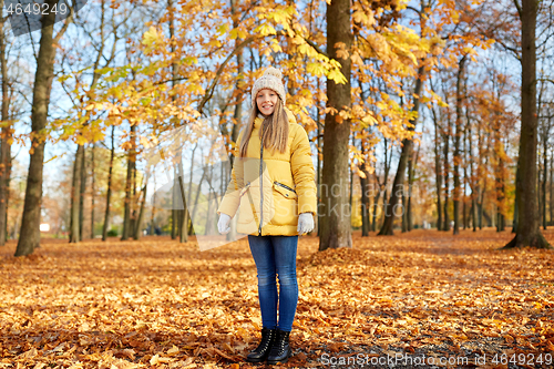 Image of happy girl at autumn park