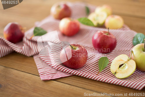 Image of ripe red apples on wooden table