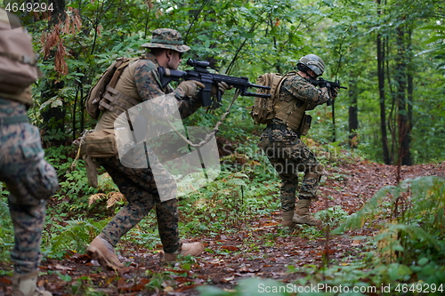 Image of Modern warfare Soldiers  Squad  in battle