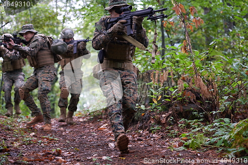 Image of Modern warfare Soldiers  Squad  in battle