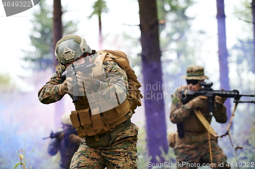 Image of Modern warfare Soldiers  Squad  in battle