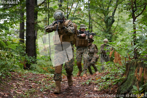 Image of Modern warfare Soldiers  Squad  in battle