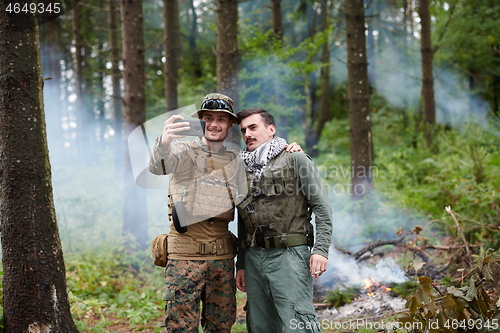 Image of soldiers and terrorist taking selfie