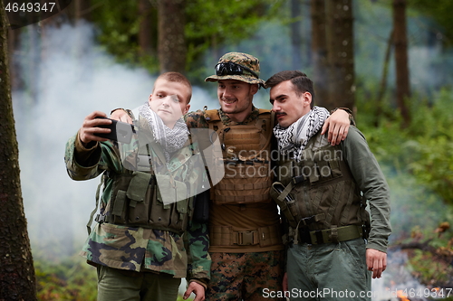 Image of soldiers and terrorist taking selfie