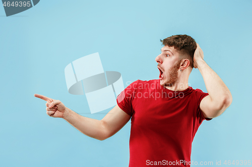 Image of Isolated on pink young casual man shouting at studio