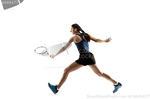 Image of Full length portrait of young woman playing tennis isolated on white background