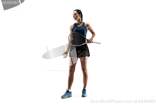 Image of Full length portrait of young woman playing tennis isolated on white background