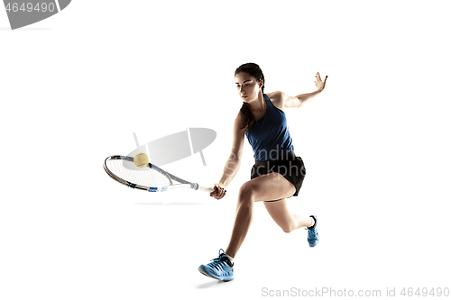 Image of Full length portrait of young woman playing tennis isolated on white background
