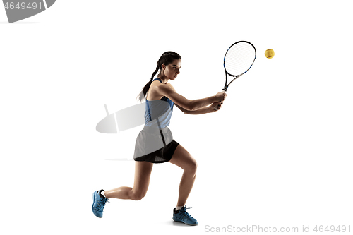 Image of Full length portrait of young woman playing tennis isolated on white background