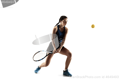 Image of Full length portrait of young woman playing tennis isolated on white background