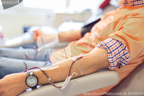 Image of Blood donor at donation with a bouncy ball holding in hand