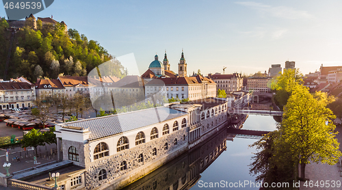 Image of Aerial drone panoramic view of Ljubljana medieval city center, capital of Slovenia in warm afternoon sun. Empty streets during corona virus pandemic social distancing measures