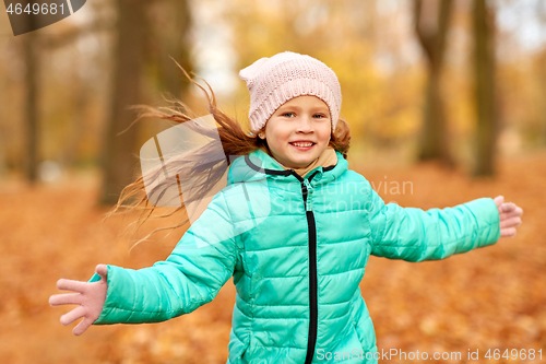 Image of happy girl at autumn park