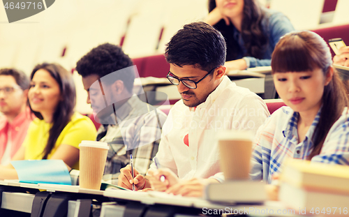 Image of group of students with coffee writing on lecture