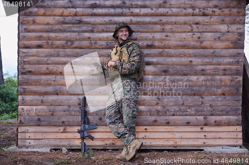 Image of soldier using tablet computer in military camp