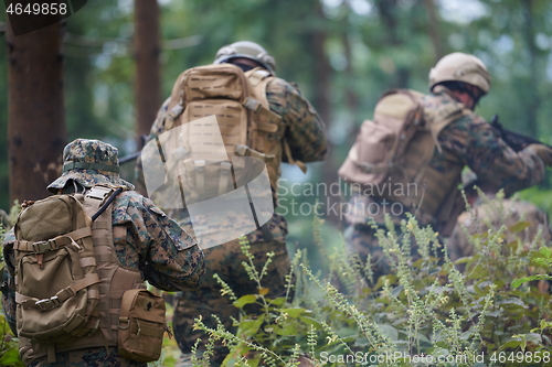 Image of Modern warfare Soldiers  Squad  in battle