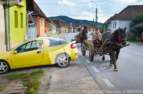 Image of People driving horse cart. Romania