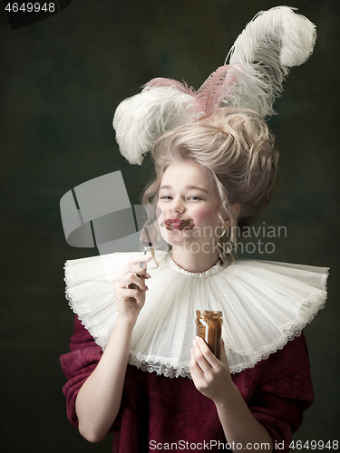 Image of Young woman as Marie Antoinette on dark background. Retro style, comparison of eras concept.