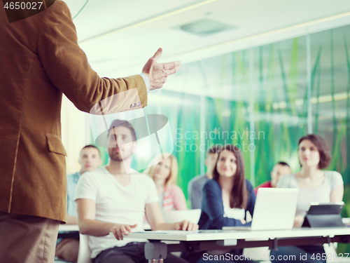 Image of close up of teacher hand while teaching in classroom